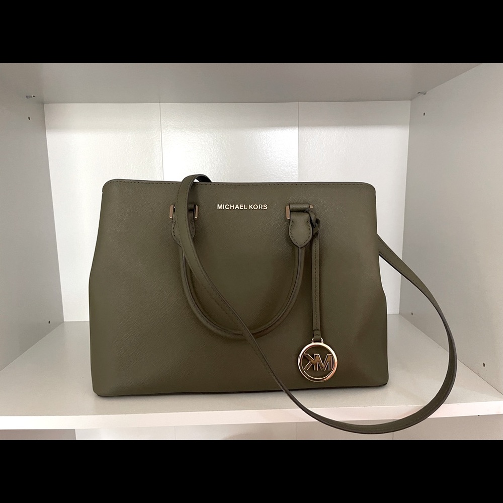 Olive Green Michael Kors bag with crossbody strap.